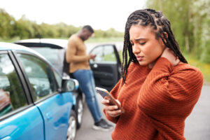 A woman and a man calling to report a personal injury from a auto accident.